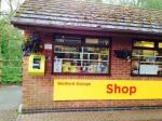 Welford Garage Shop with defibrillator on left hand end of wall